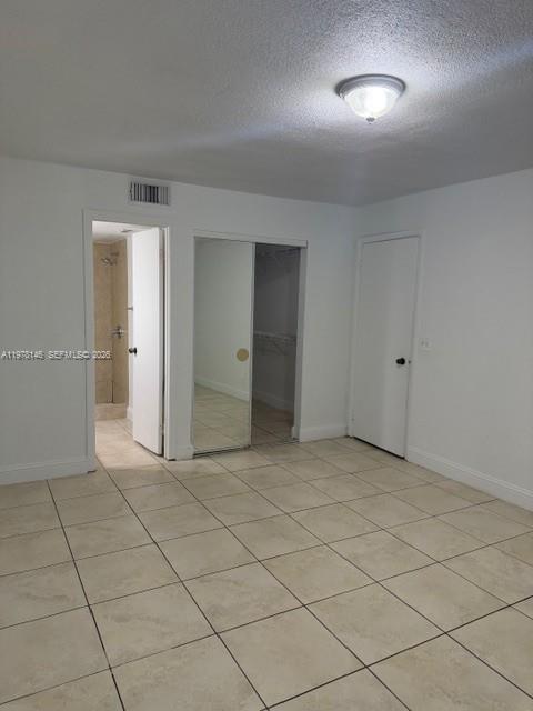 8781 Wiles Road, Unit 103 Coral Springs, FL 33067 - Photo 13 of 19 an empty room with a bathroom