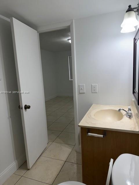 8781 Wiles Road, Unit 103 Coral Springs, FL 33067 - Photo 17 of 19 a bathroom with a sink toilet and tub