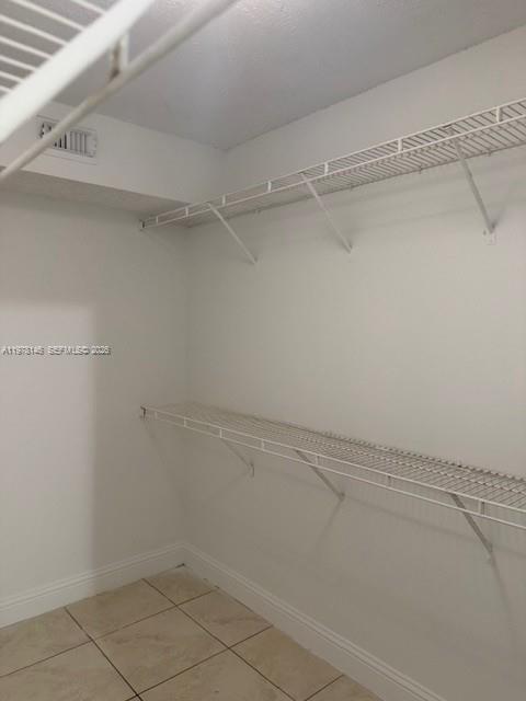 8781 Wiles Road, Unit 103 Coral Springs, FL 33067 - Photo 18 of 19 a view of a room with racks on the wall