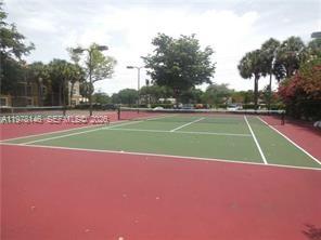 8781 Wiles Road, Unit 103 Coral Springs, FL 33067 - Photo 5 of 19 a view of a tennis court