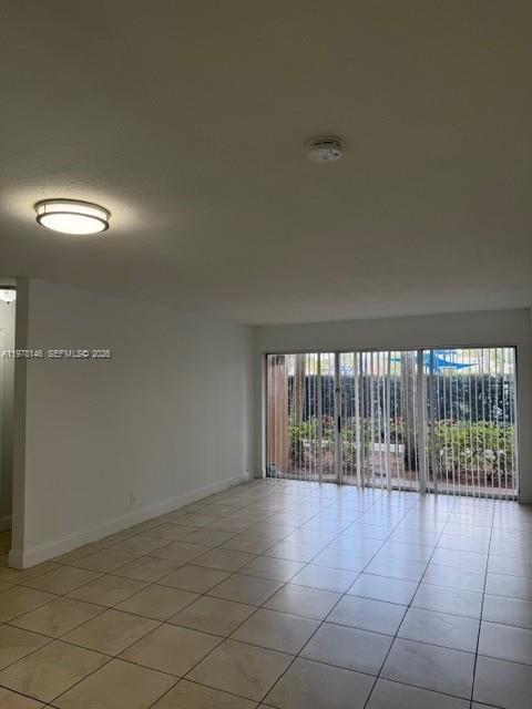 8781 Wiles Road, Unit 103 Coral Springs, FL 33067 - Photo 7 of 19 a view of an empty room and window
