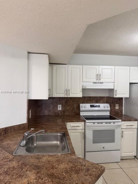 8781 Wiles Road, Unit 103 Coral Springs, FL 33067 - Photo 10 of 19 a kitchen that has a sink and a stove