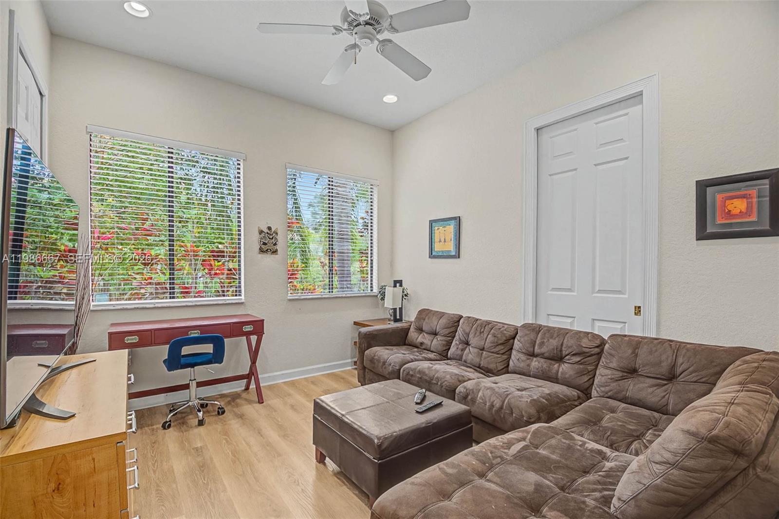19528 Southwest 79th Place Cutler Bay, FL 33157 - Photo 21 of 41 a living room with furniture and a large window