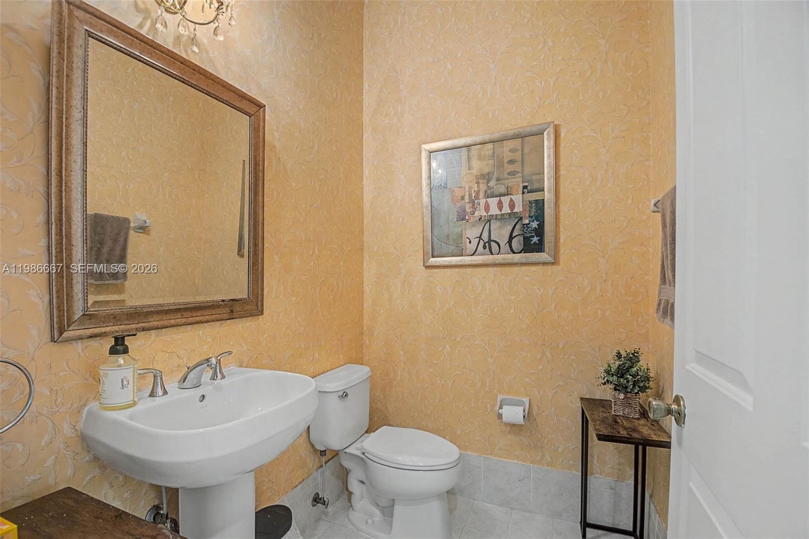 19528 Southwest 79th Place Cutler Bay, FL 33157 - Photo 25 of 41 a bathroom with a toilet sink and mirror