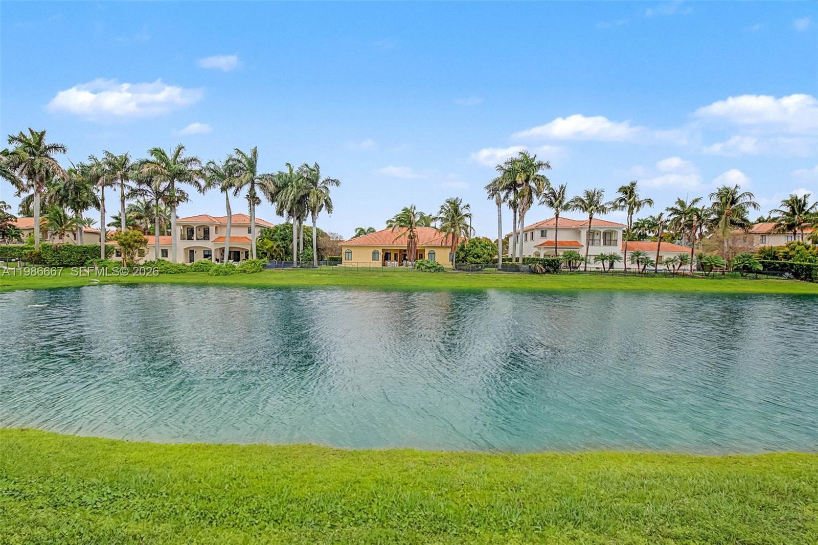 19528 Southwest 79th Place Cutler Bay, FL 33157 - Photo 32 of 41 a view of a lake with a large building in the background