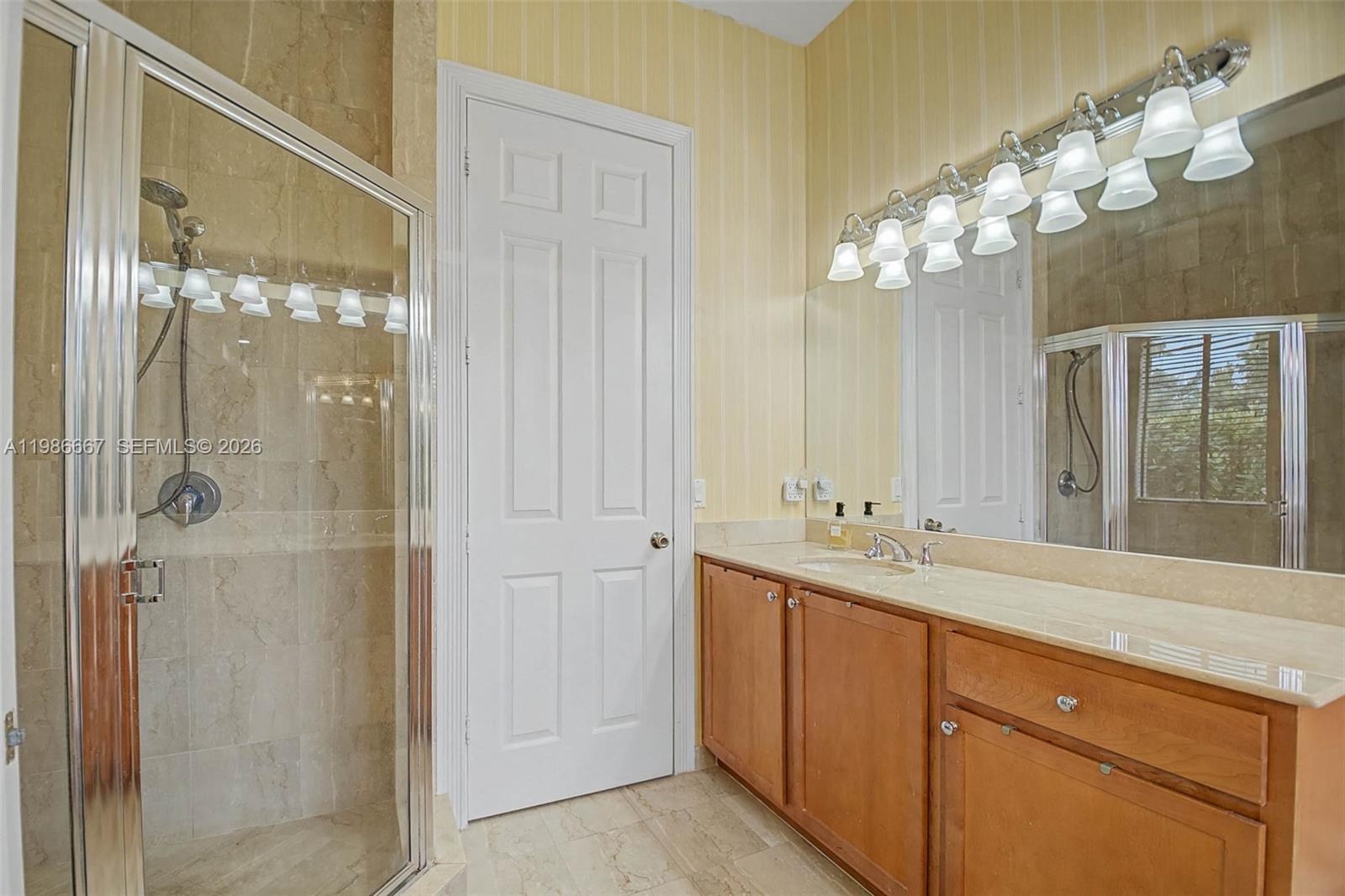 19528 Southwest 79th Place Cutler Bay, FL 33157 - Photo 10 of 41 a bathroom with a sink double vanity and a mirror