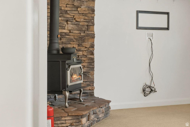 1001 Pine Valley Road Pine Valley, UT 84781 - Photo 12 of 49 Detailed view of carpet floors and a wood stove