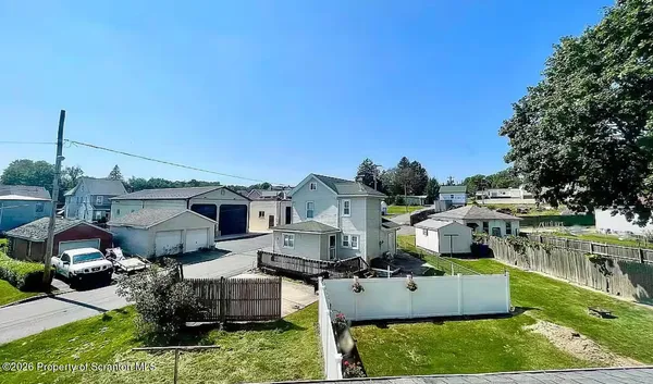 a aerial view of a house with a garden and plants