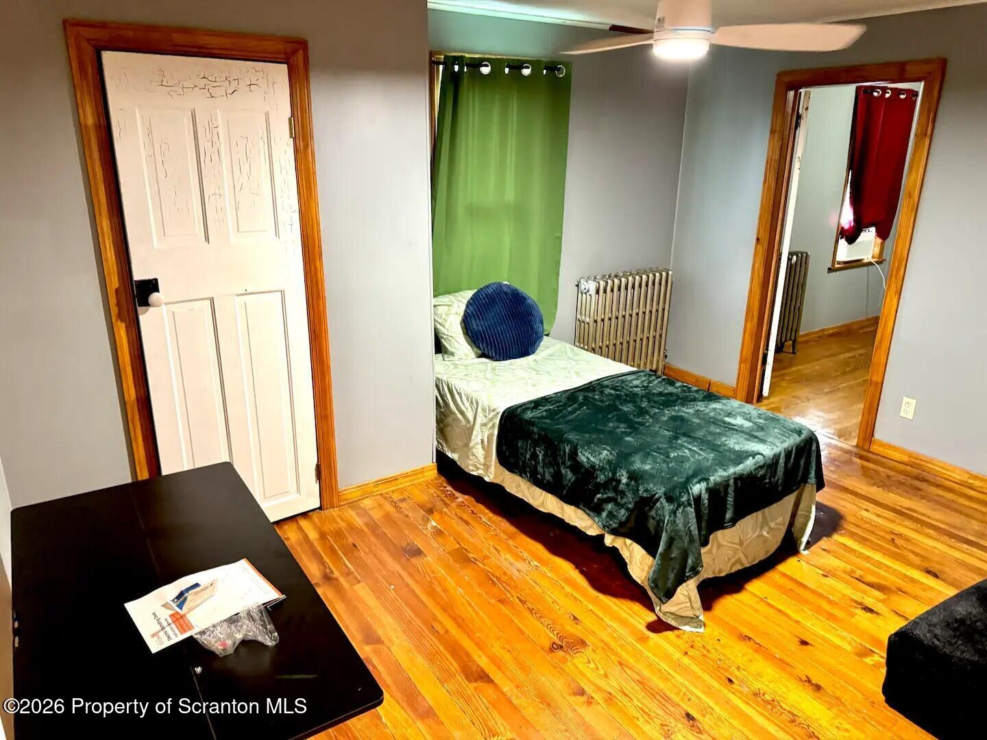 56 New Street Beaver Meadows, PA 18216 - Photo 8 of 11 a bedroom with a bed and a mirror