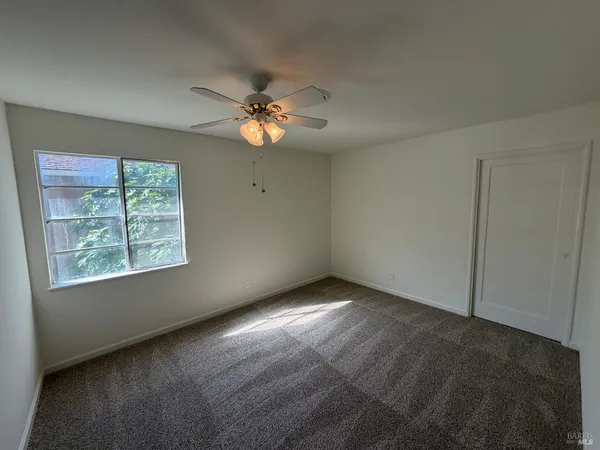 a view of empty room with windows
