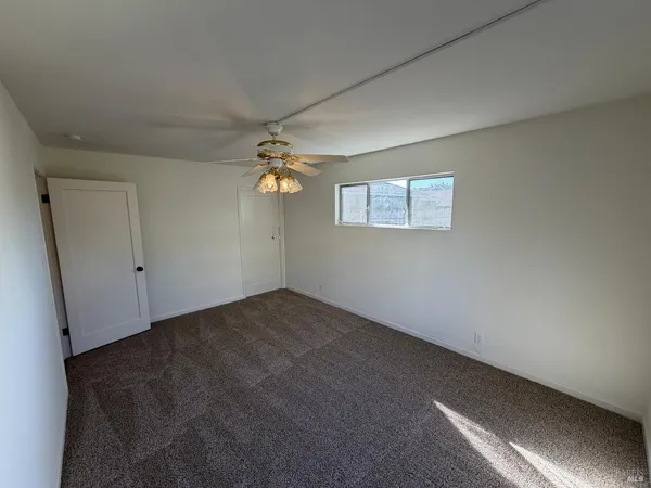 a view of empty room with windows