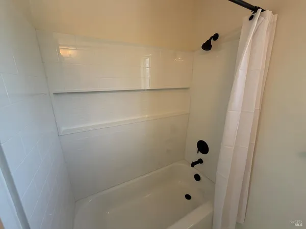 a bathroom with a sink toilet and tub