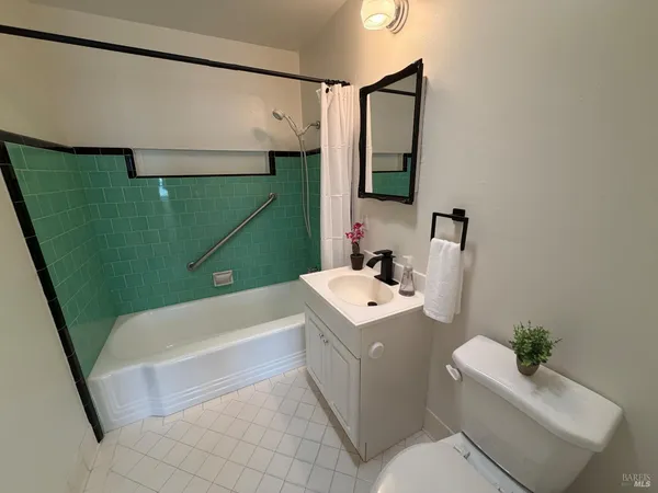 a bathroom with a sink a vanity and a mirror