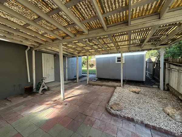 a view of a room with wooden walls