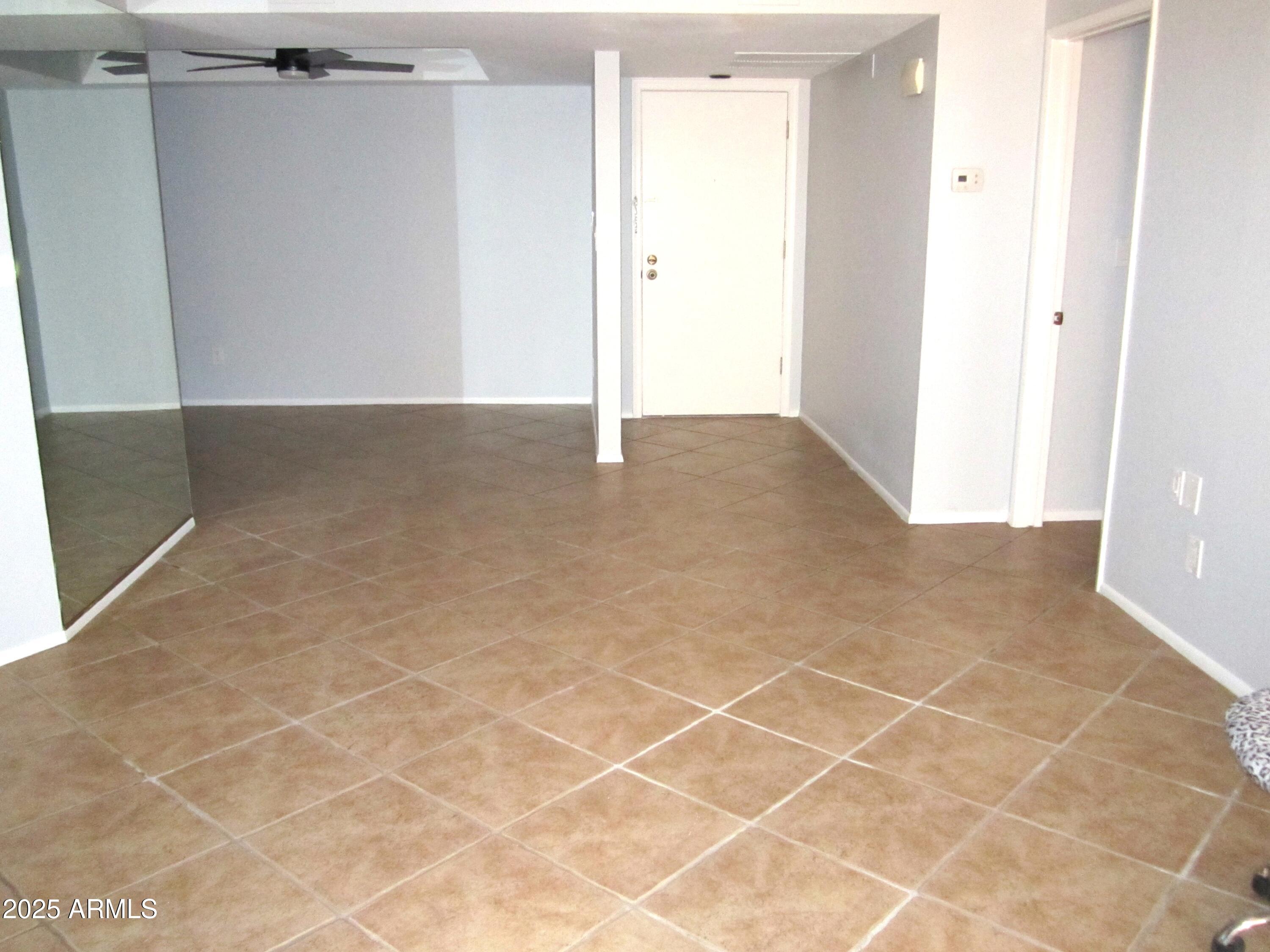 4303 East Cactus Road, Unit 331 Phoenix, AZ 85032 - Photo 3 of 34 9 331 ENTRY DOOR & DINING AREA