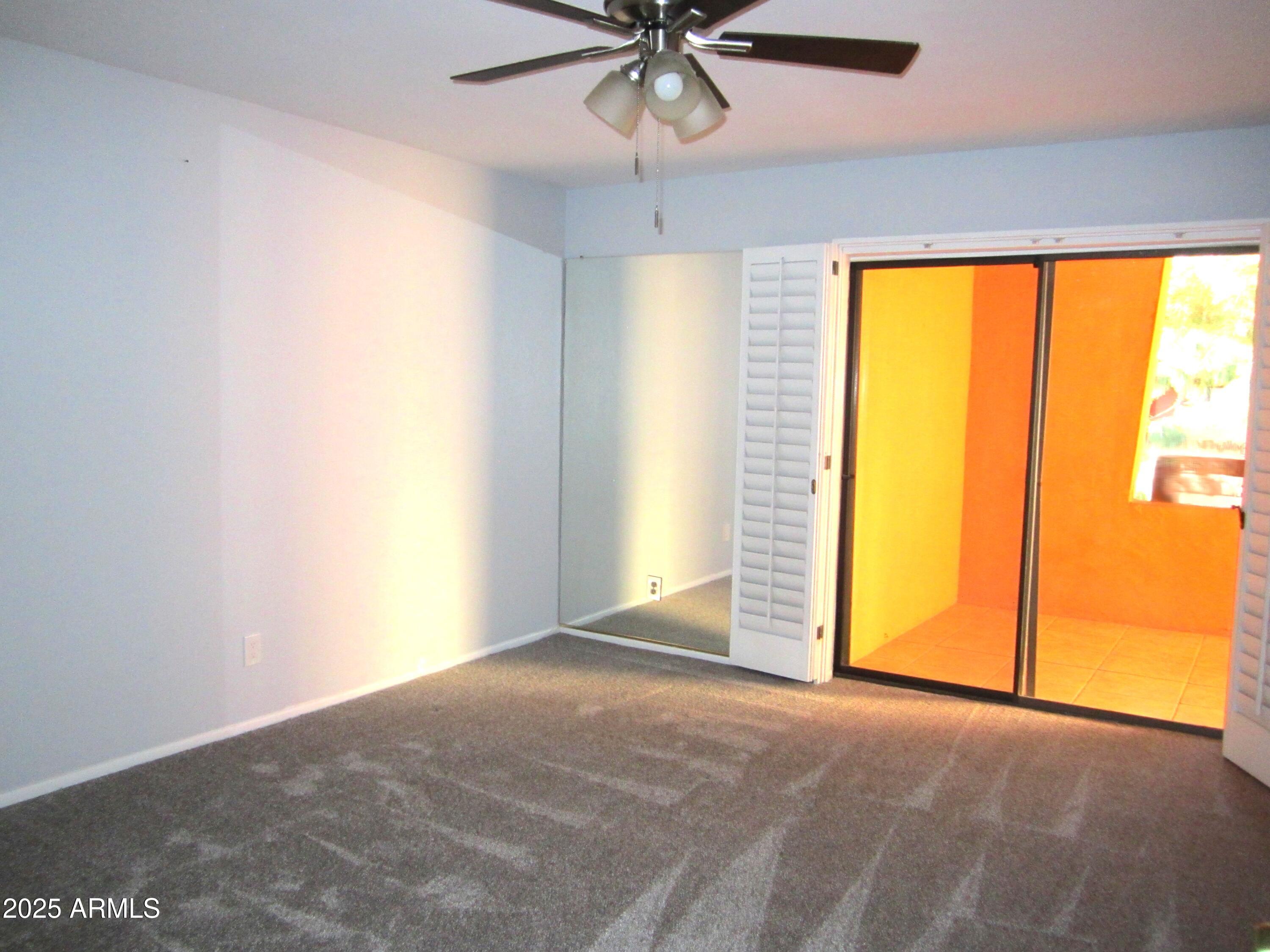 4303 East Cactus Road, Unit 331 Phoenix, AZ 85032 - Photo 10 of 34 9 331 PRIMARY BEDROOM WITH PATIO