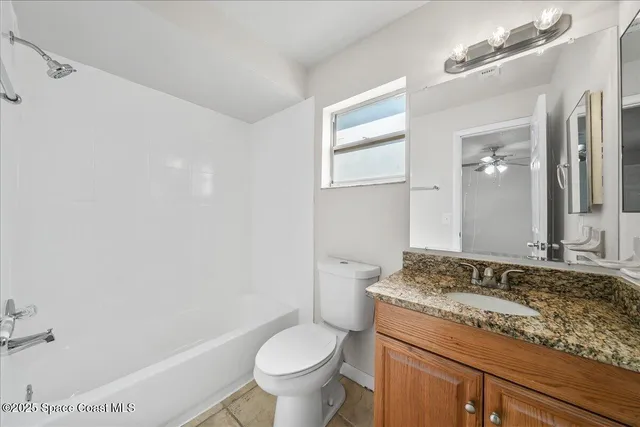 a view of a backyard with a large tree