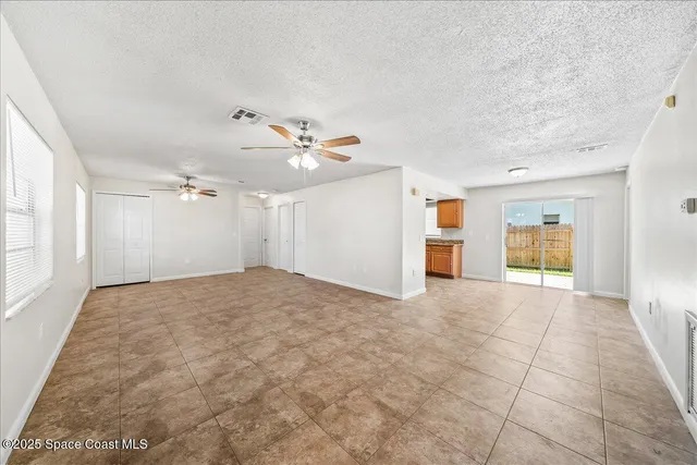 a view of a kitchen with a sink stove and cabinets