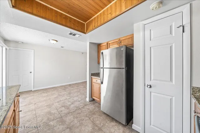 a kitchen that has a sink and a stove