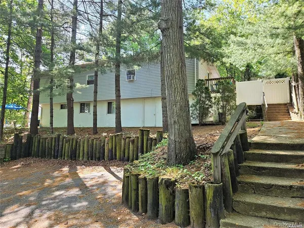 a view of outdoor space with deck and furniture
