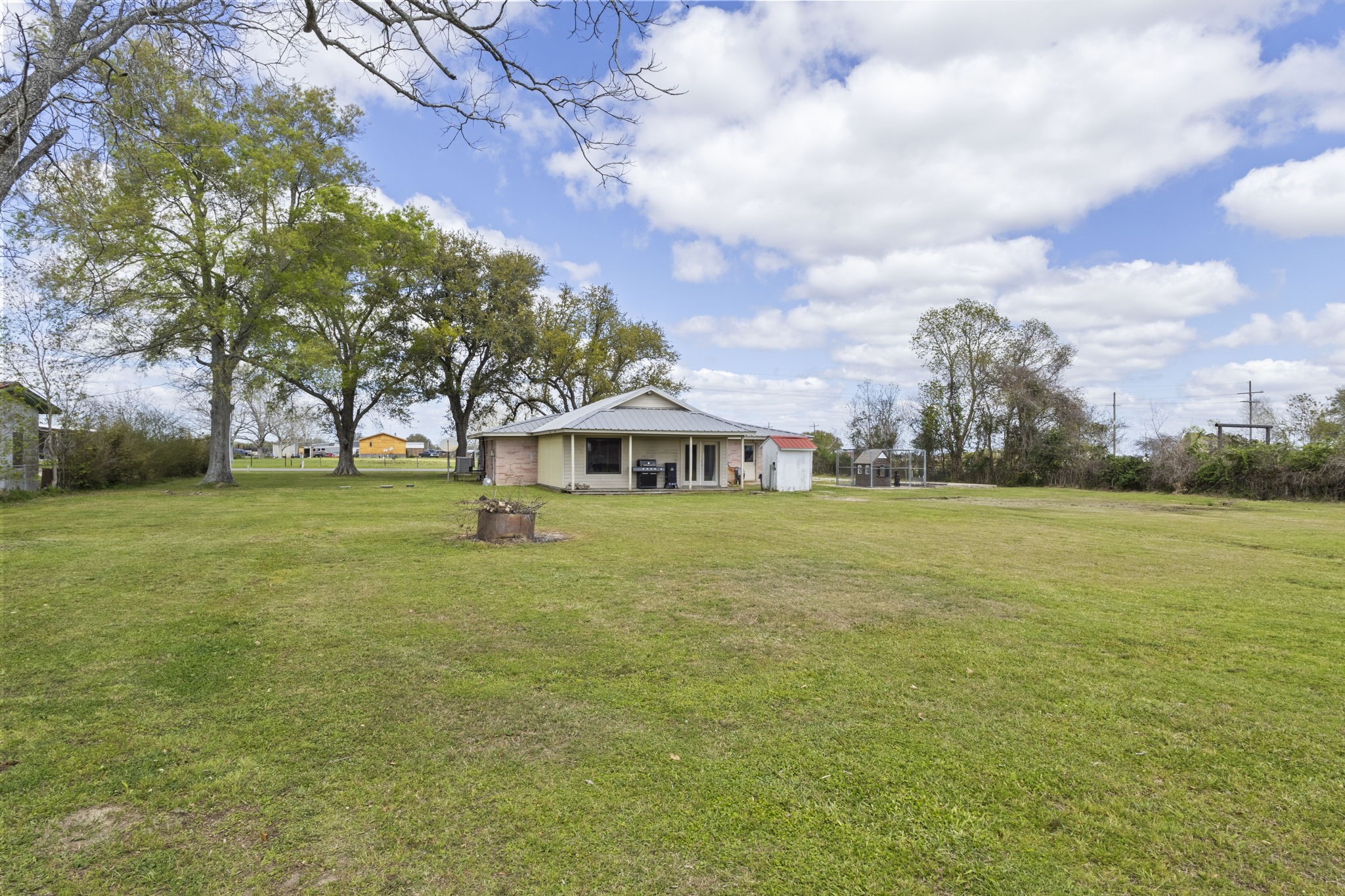 19961 Englin Road Winnie, TX 77665 - Photo 7 of 26 a view of a house with a big yard