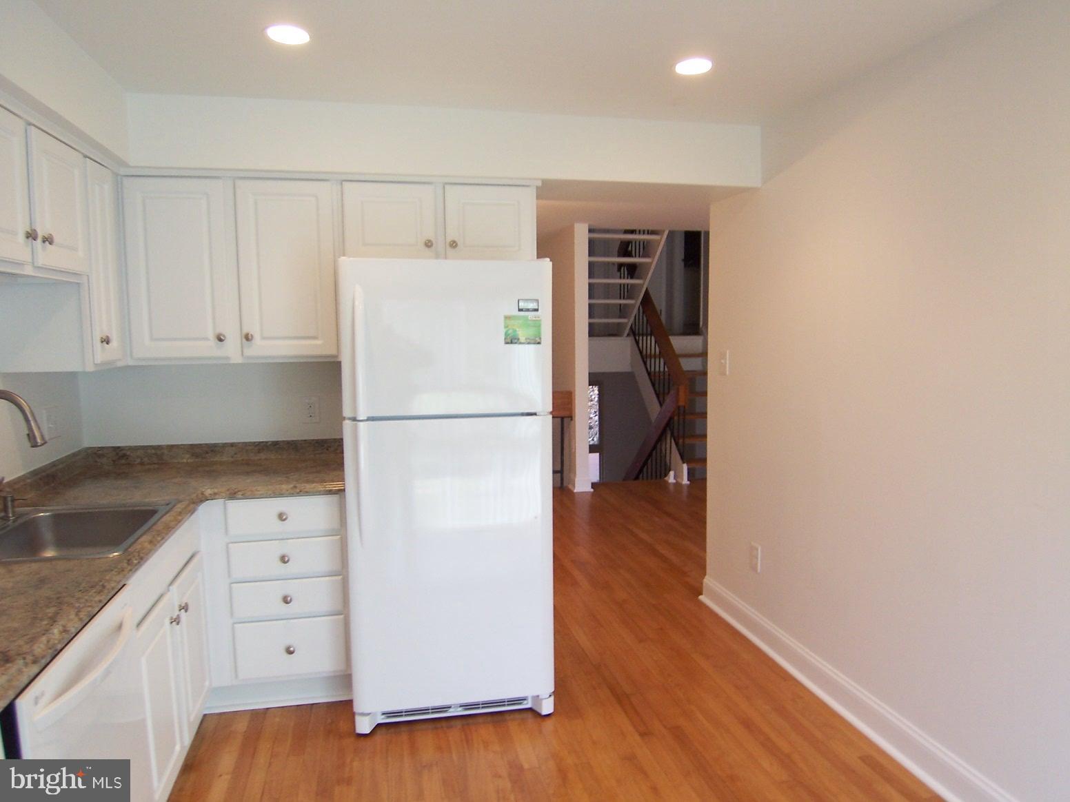 11677 Newbridge Court Reston, VA 20191 - Photo 5 of 23 KITCHEN TO DINING ROOM