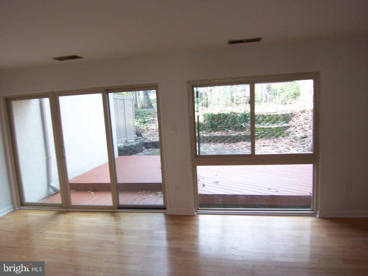 11677 Newbridge Court Reston, VA 20191 - Photo 7 of 23 LIVING ROOM TO DECK