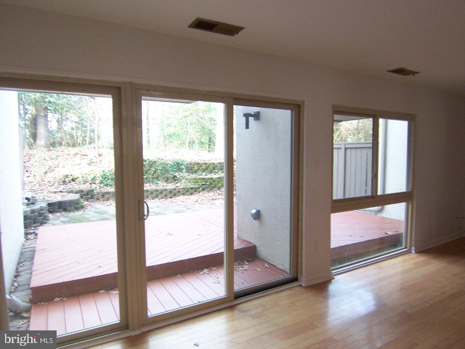 11677 Newbridge Court Reston, VA 20191 - Photo 8 of 23 LIVING ROOM TO DECK