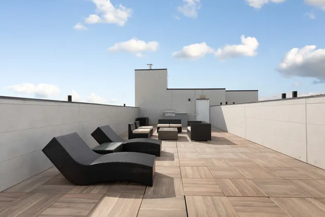 a terrace view with two chair and a potted plant