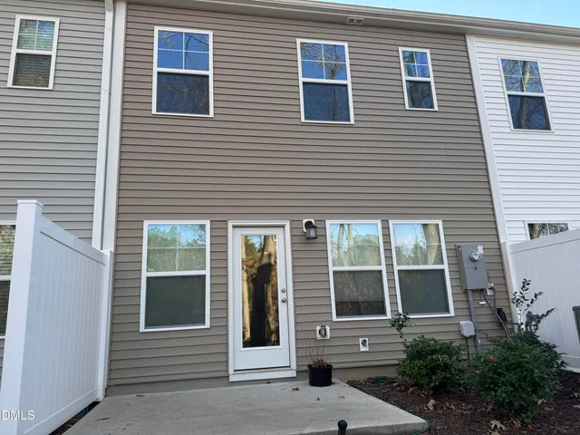a view of a brick house with a large windows