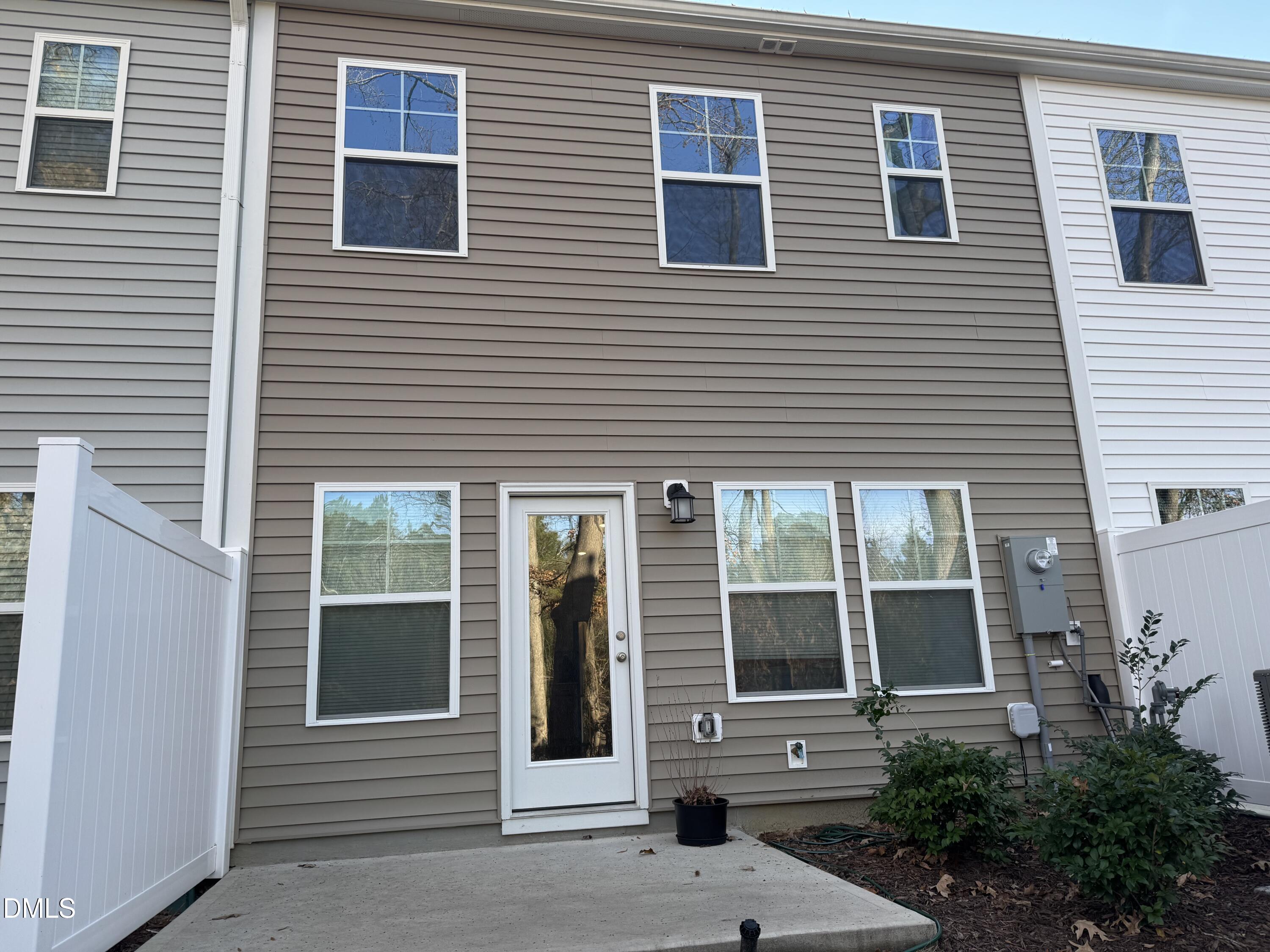 237 Peebles Drive Smithfield, NC 27577 - Photo 17 of 21 a view of a brick house with a large windows