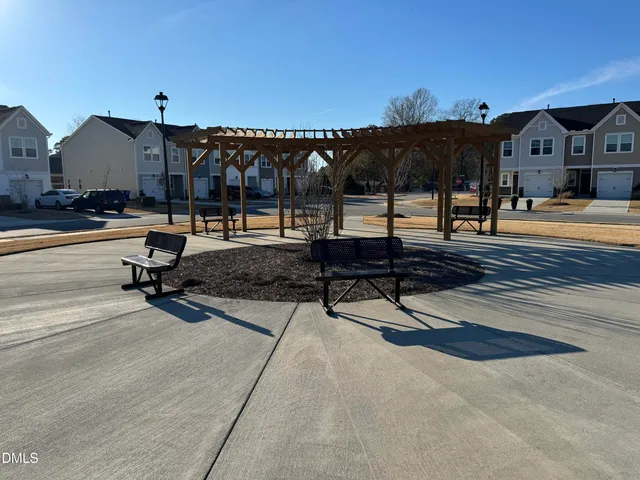 a view of a patio with a table and chairs