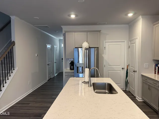 a bedroom with a bed and a large mirror