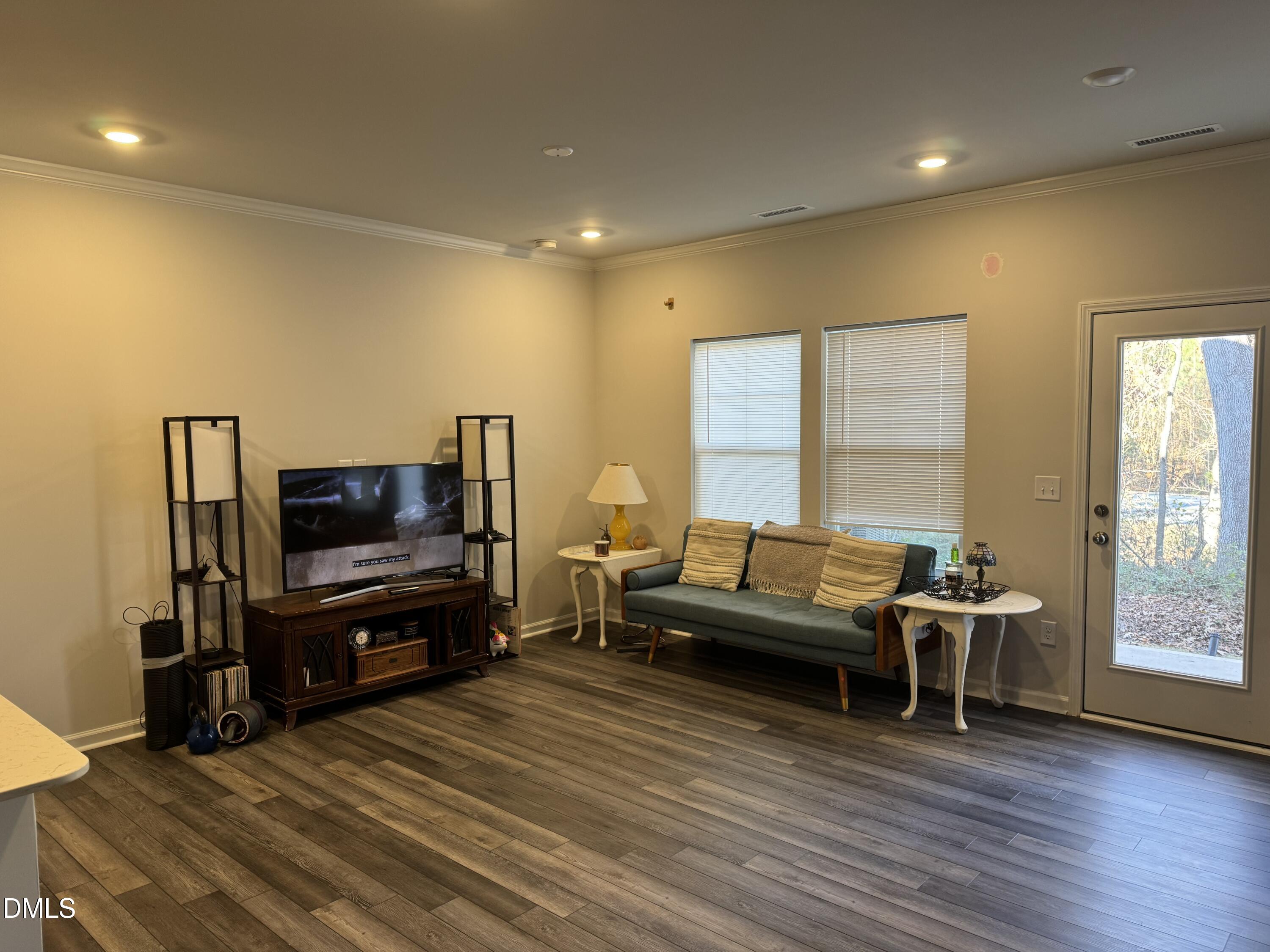 237 Peebles Drive Smithfield, NC 27577 - Photo 4 of 21 a living room with furniture and a flat screen tv