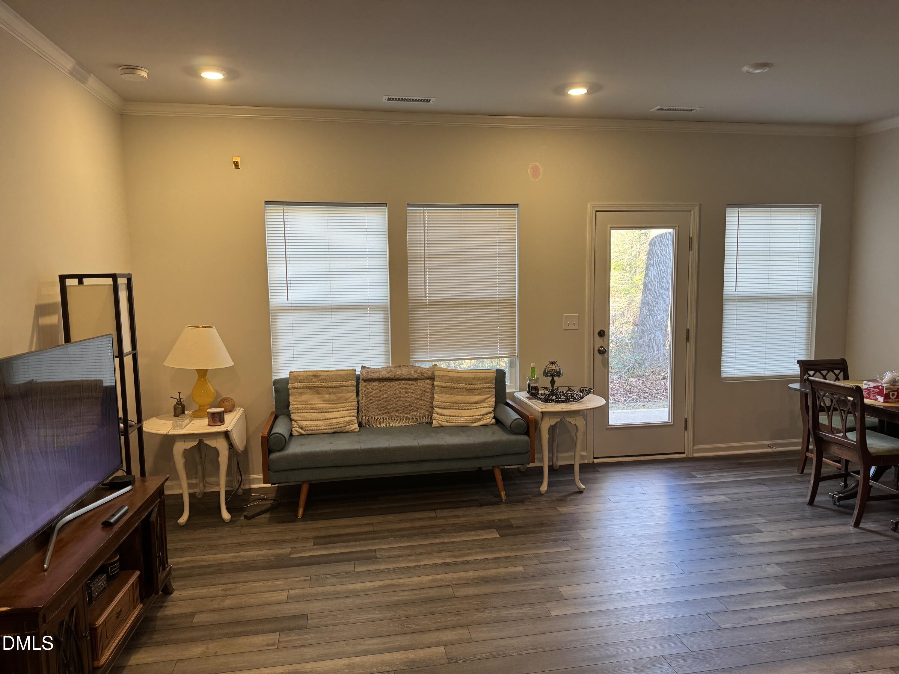 237 Peebles Drive Smithfield, NC 27577 - Photo 7 of 21 a living room with furniture and a wooden floor