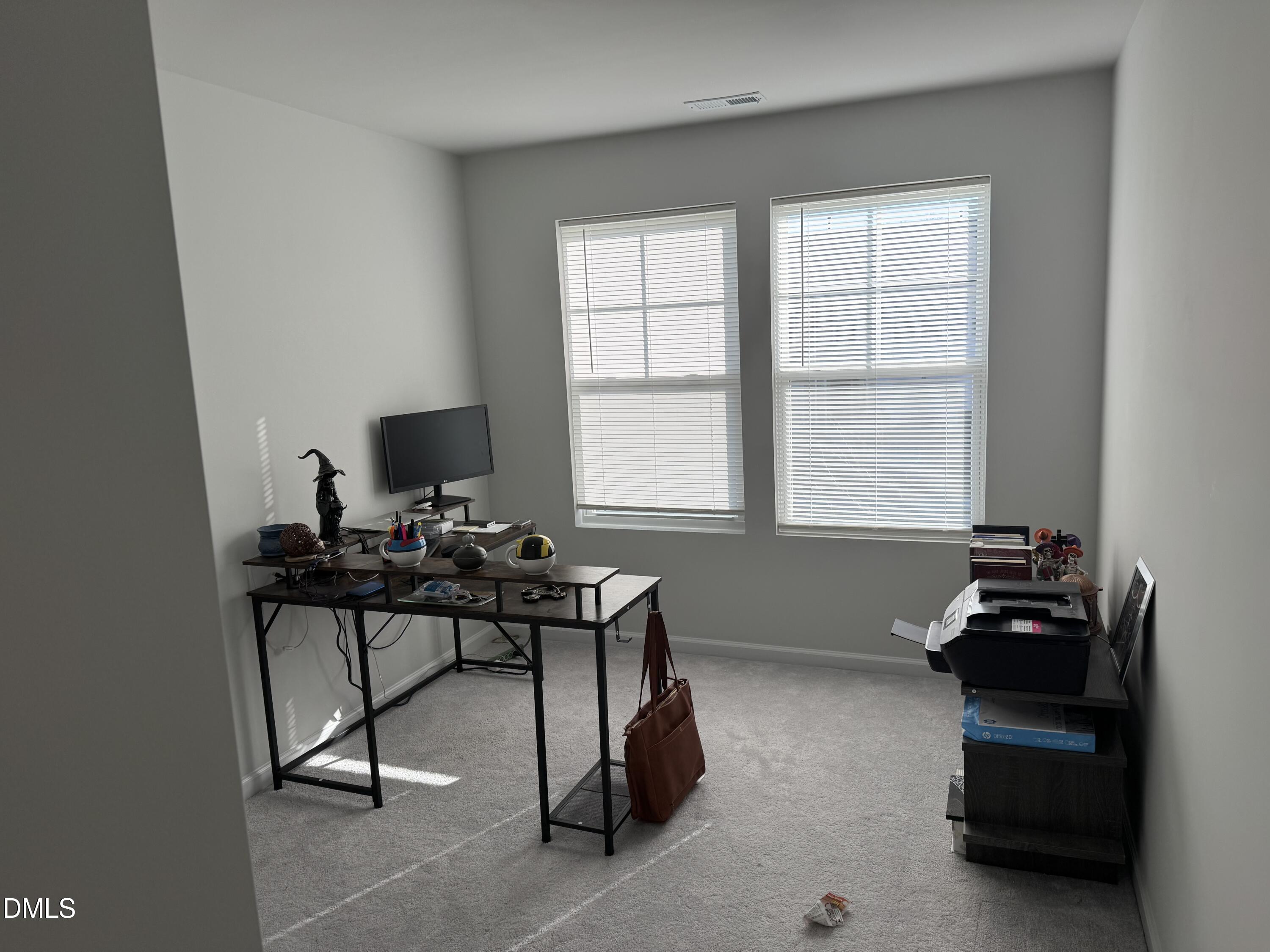 237 Peebles Drive Smithfield, NC 27577 - Photo 8 of 21 a view of a workspace with furniture and a window