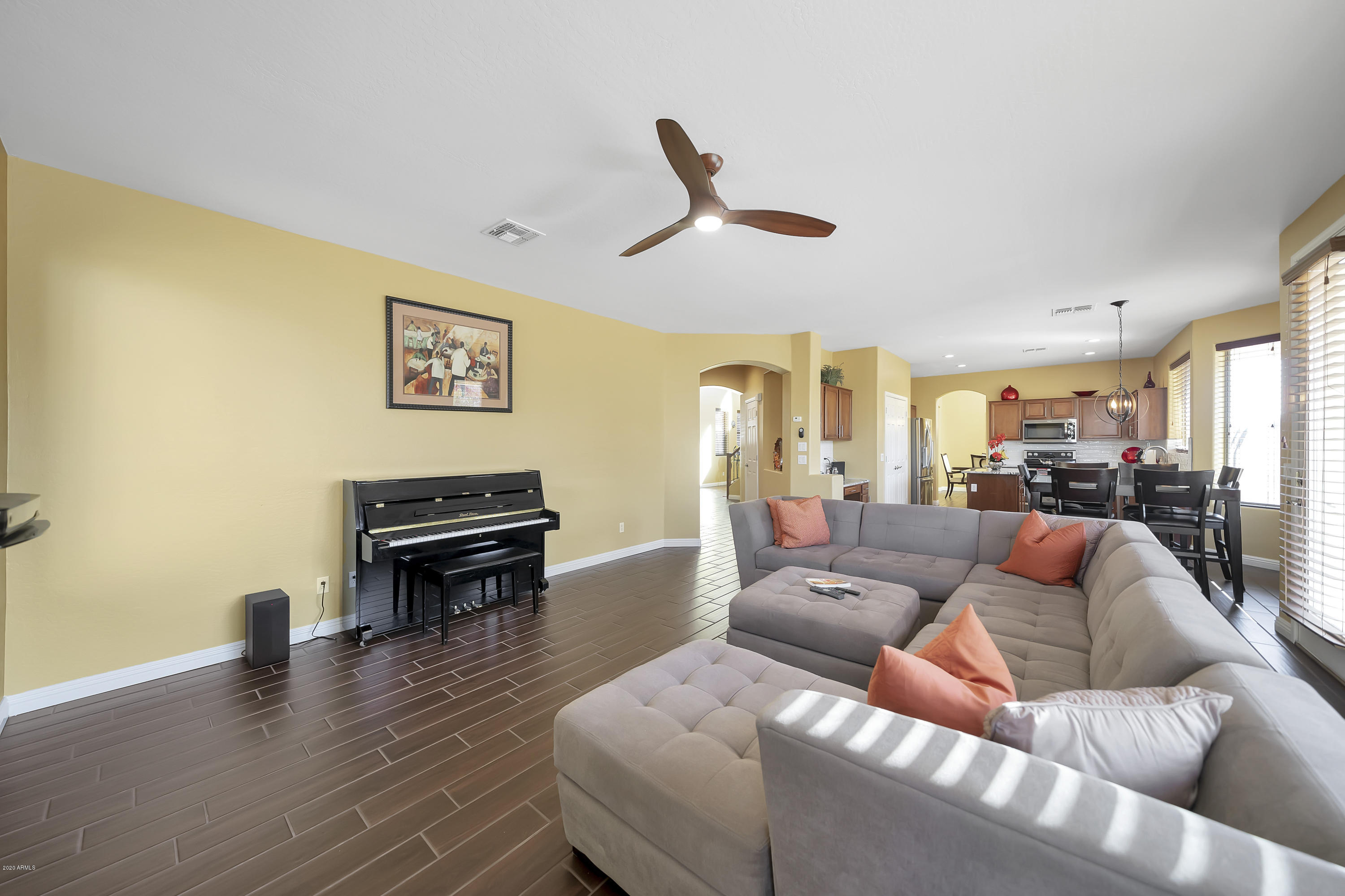 14103 West Bloomfield Road Surprise, AZ 85379 - Photo 23 of 51 a living room with furniture and a wooden floor