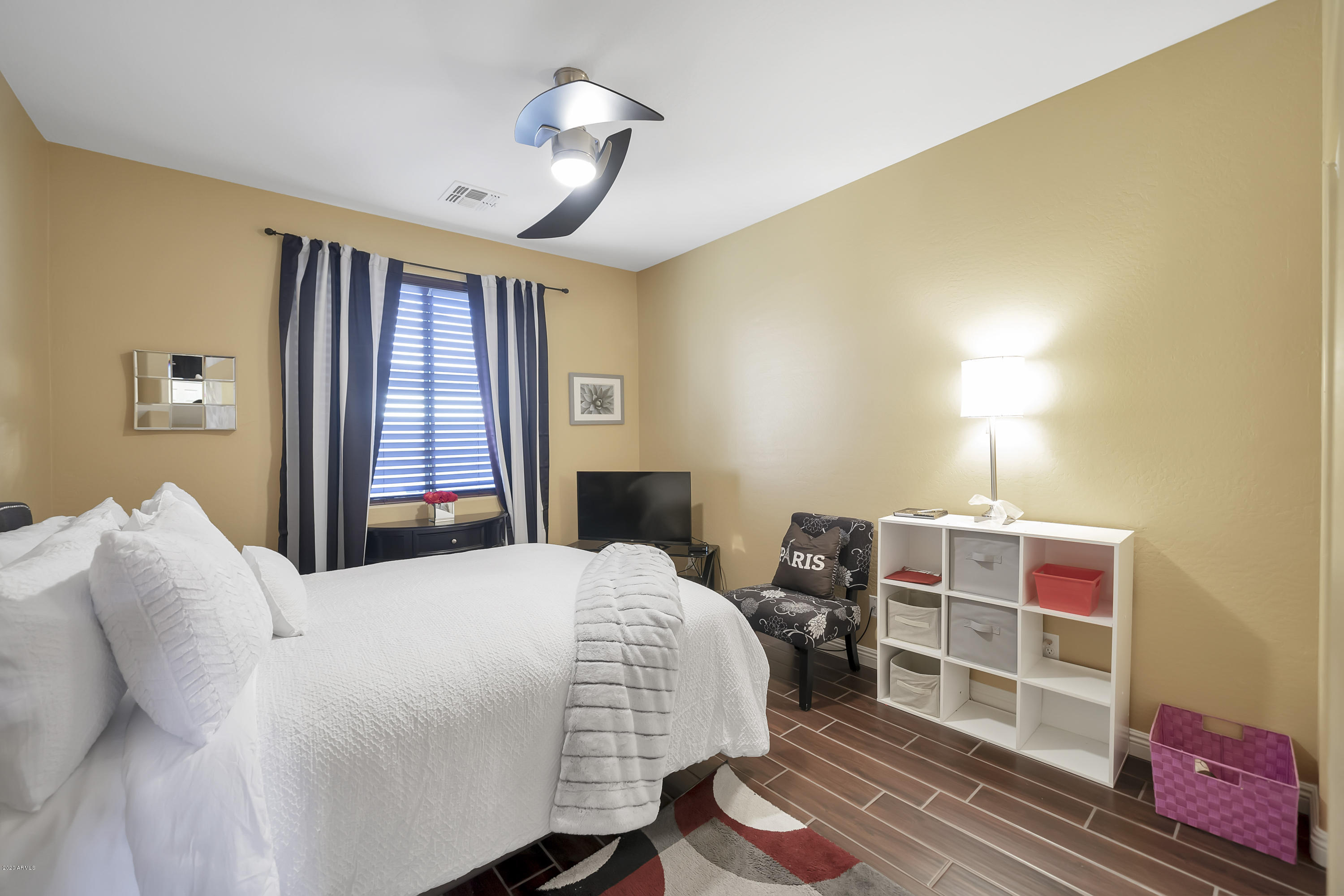 14103 West Bloomfield Road Surprise, AZ 85379 - Photo 24 of 51 a bedroom with a bed and a chandelier