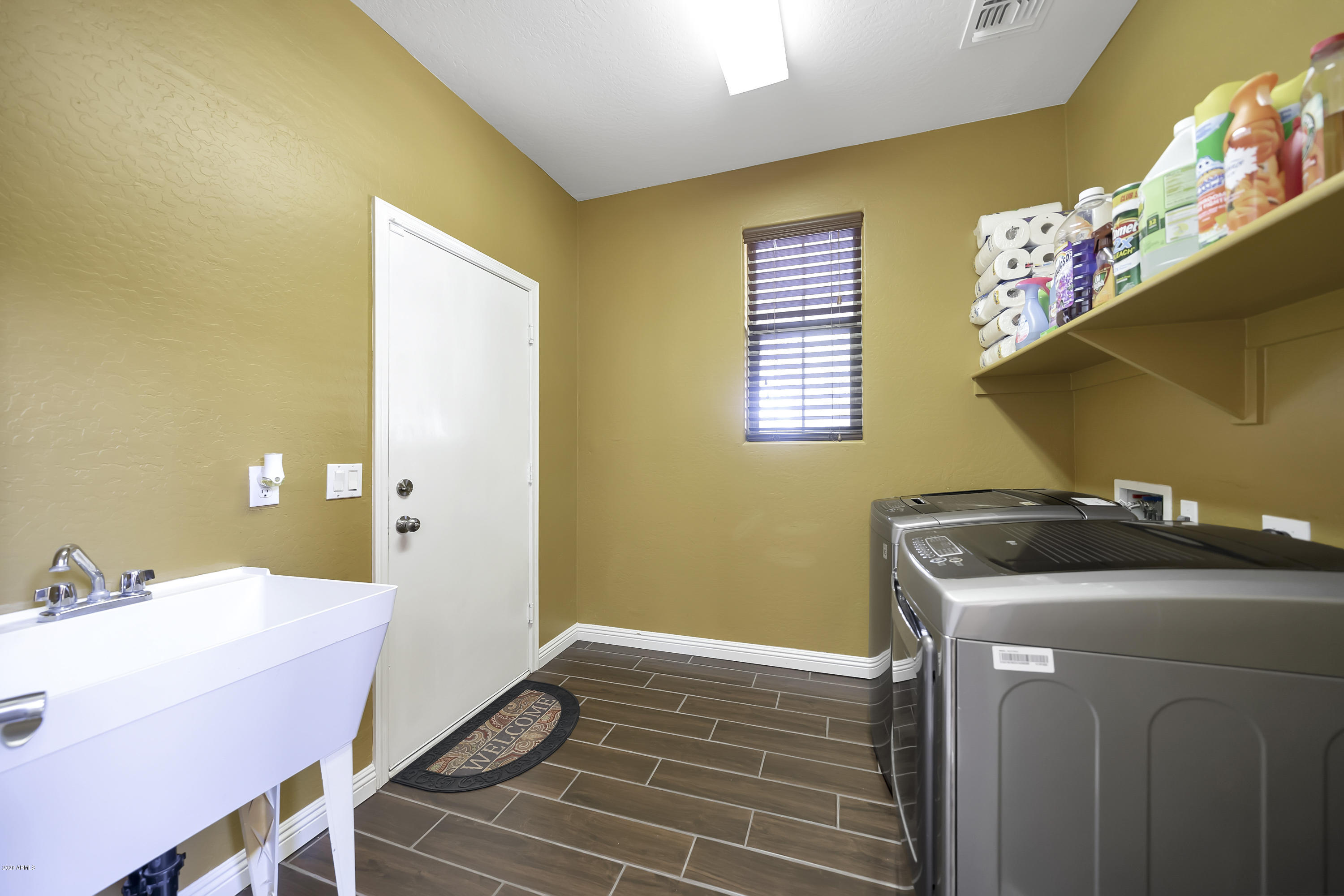 14103 West Bloomfield Road Surprise, AZ 85379 - Photo 26 of 51 a utility room with a sink dryer and washer