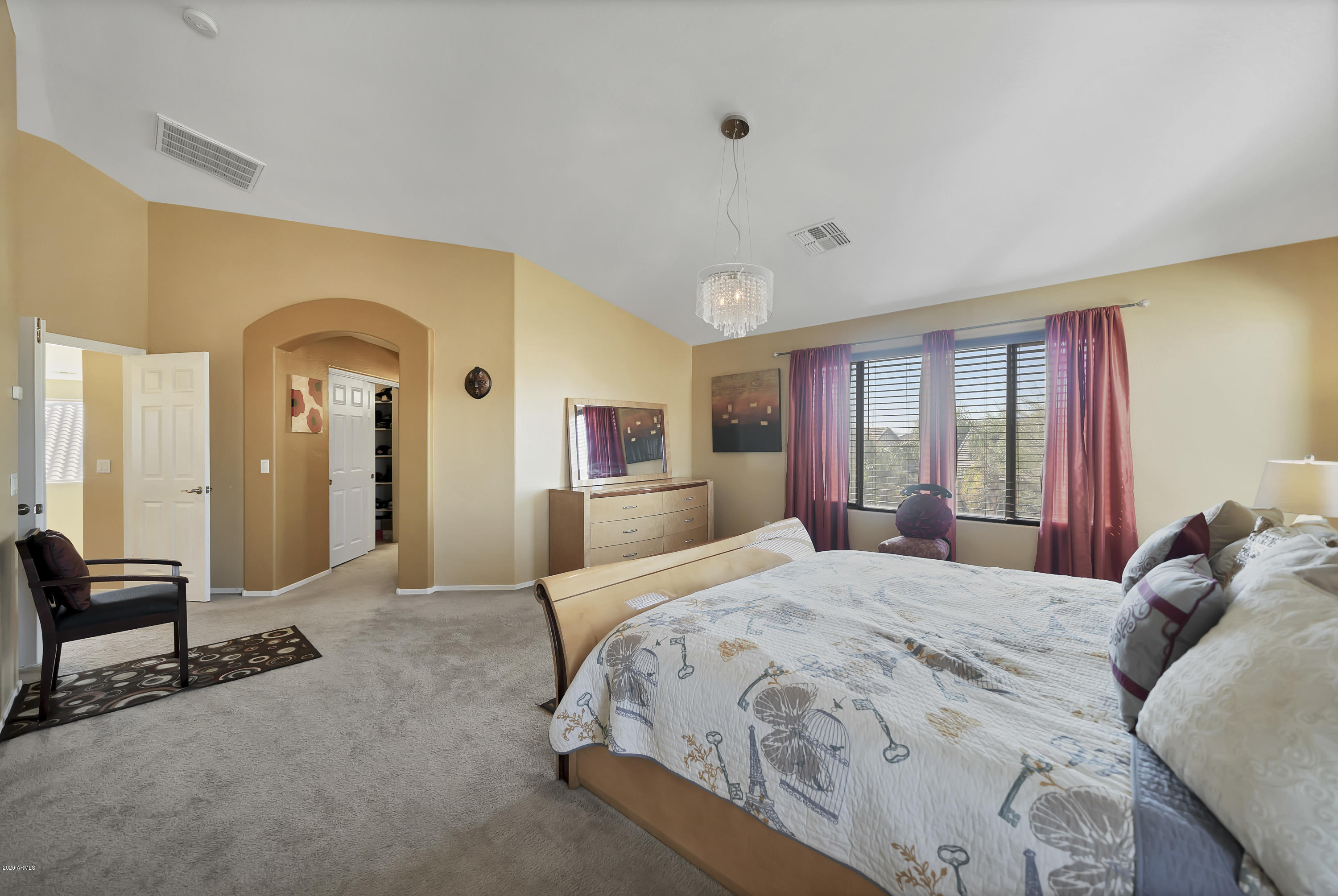 14103 West Bloomfield Road Surprise, AZ 85379 - Photo 34 of 51 a spacious bedroom with a large bed and windows