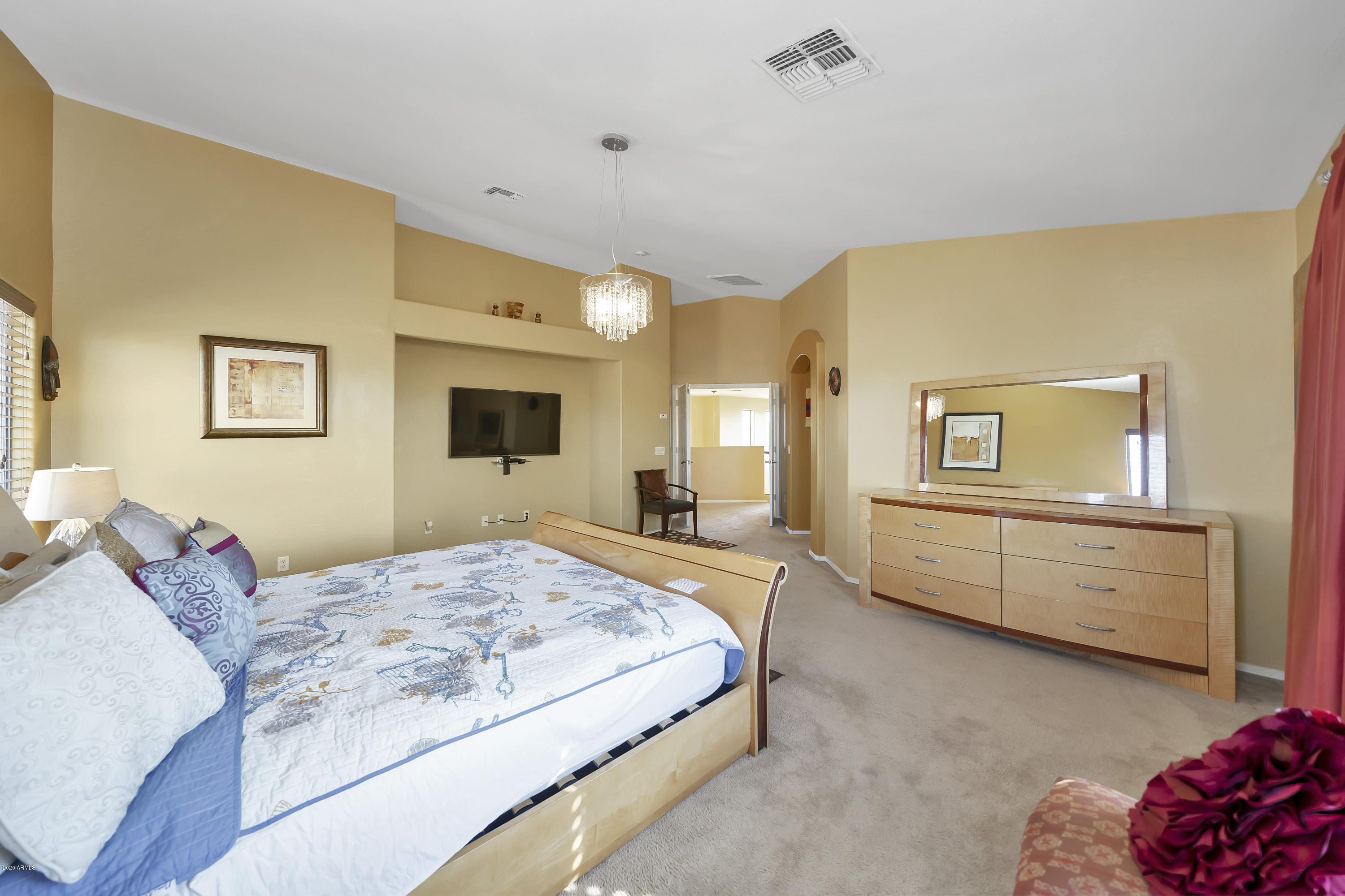 14103 West Bloomfield Road Surprise, AZ 85379 - Photo 35 of 51 a bedroom with a bed and dresser