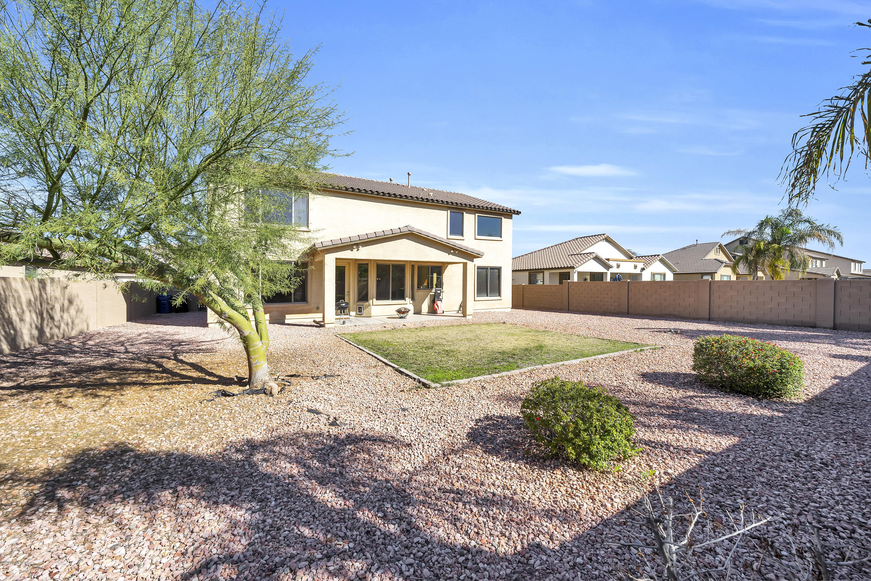 14103 West Bloomfield Road Surprise, AZ 85379 - Photo 45 of 51 a view of a front of a house with a yard