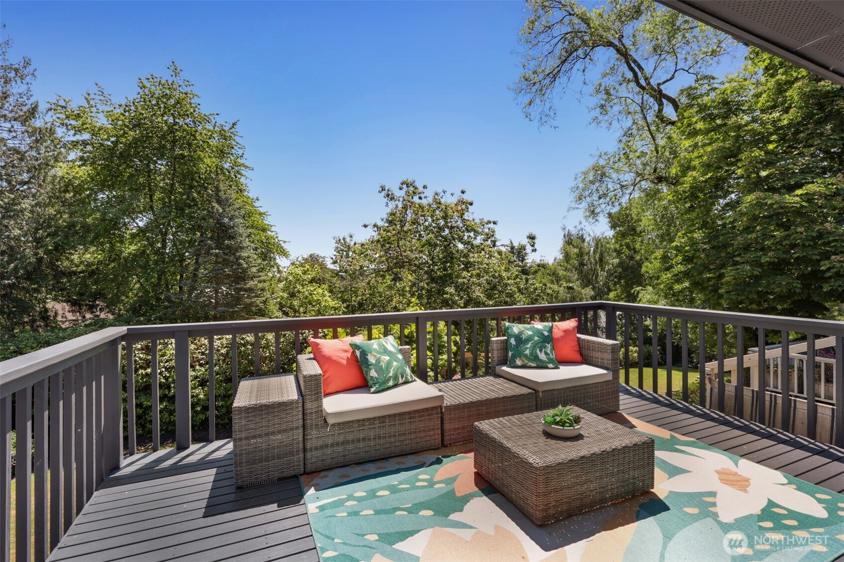 2547 Northeast 83rd Street Seattle, WA 98115 - Photo 16 of 38 a balcony with wooden floor and outdoor seating