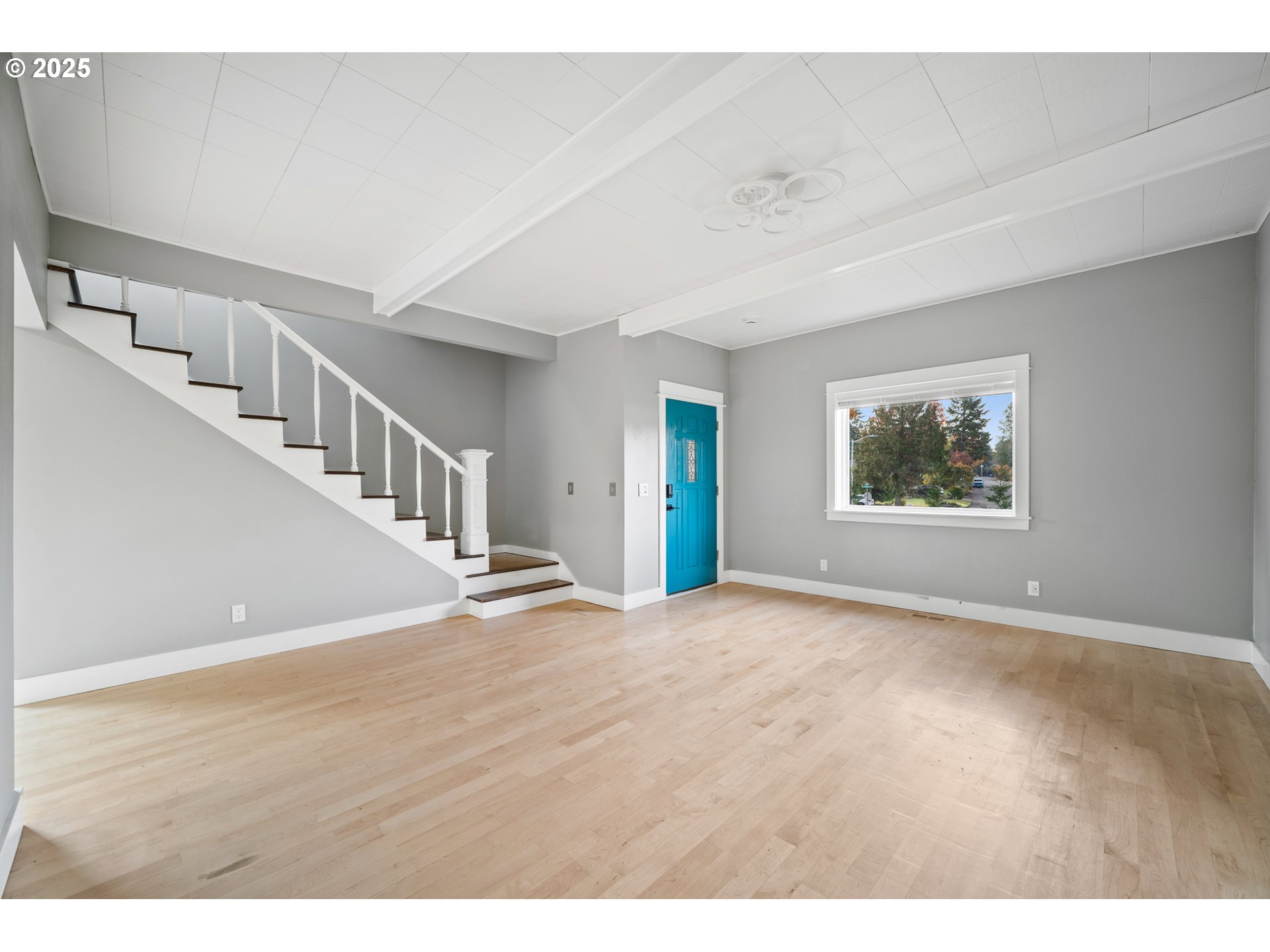 12533 Southeast Sunnyside Road Clackamas, OR 97015 - Photo 18 of 29 a view of an empty room with wooden floor and a window