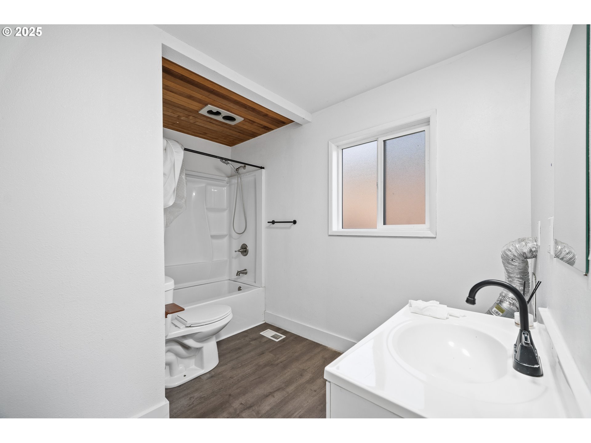 12533 Southeast Sunnyside Road Clackamas, OR 97015 - Photo 23 of 29 a bathroom with a sink a mirror and shower