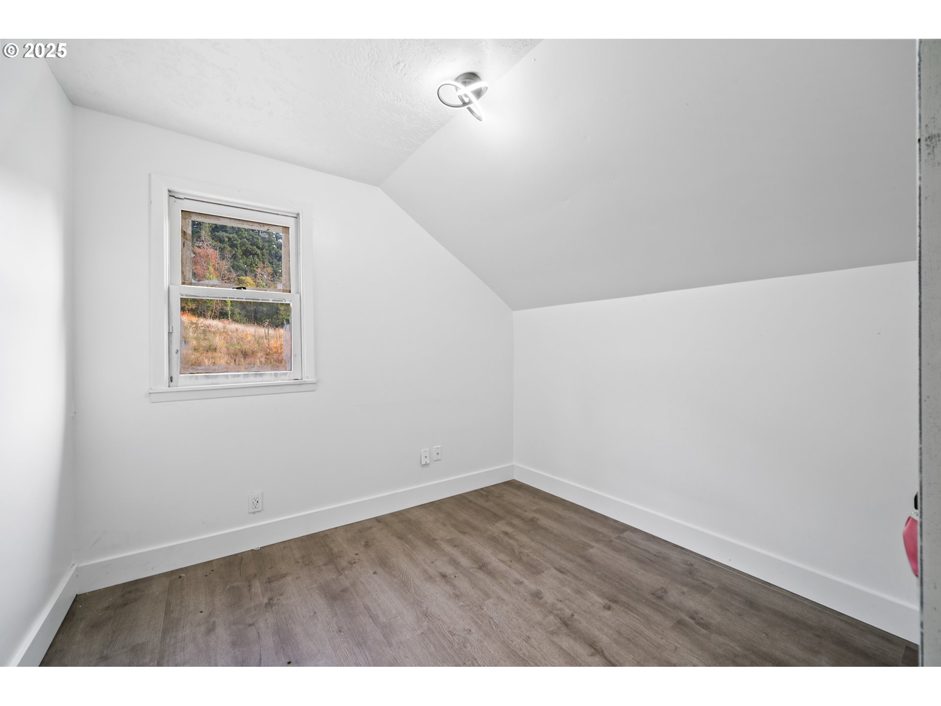 12533 Southeast Sunnyside Road Clackamas, OR 97015 - Photo 26 of 29 a view of an empty room with wooden floor