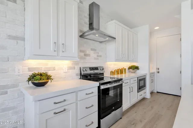 a dining room with furniture a large window and wooden floor