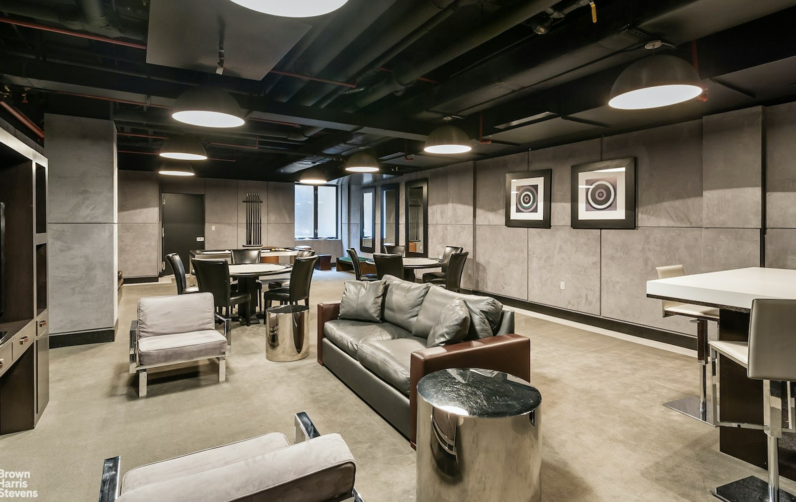 254 Park Avenue South, Unit GARDEN Manhattan, NY 10010 - Photo 10 of 18 a living room with furniture and a flat screen tv