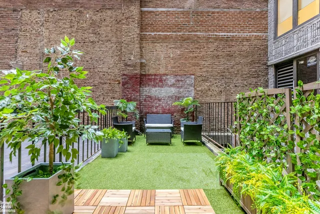 a view of yard with seating area