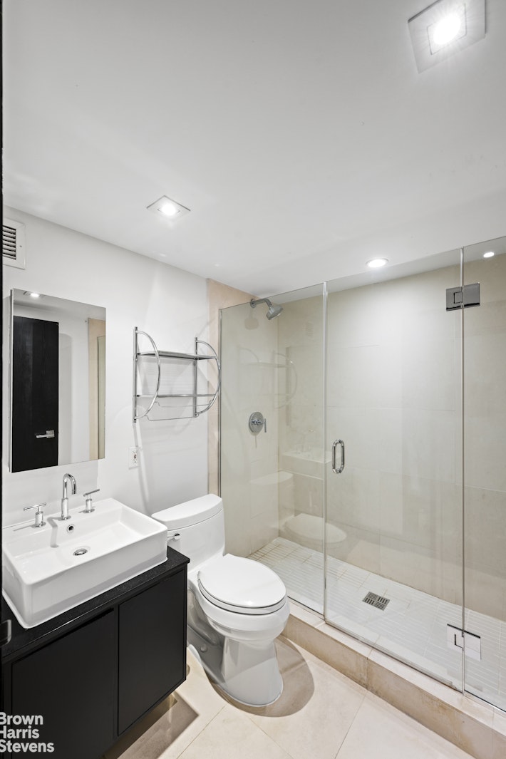 254 Park Avenue South, Unit GARDEN Manhattan, NY 10010 - Photo 7 of 18 a bathroom with a sink toilet and shower